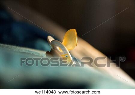 Baby´s pacifier on a bed View Large Photo Image Stock Photo - Baby´s pacifier on a bed. Fotosearch