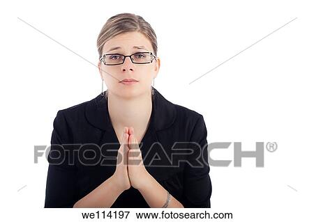 Stock Photo - Desperate young woman praying, isolated on white background. Fotosearch