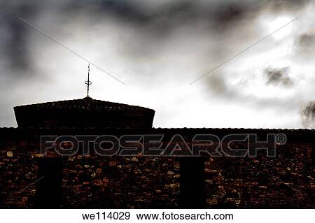 Stock Photo - Old building under the clouds. Fotosearch