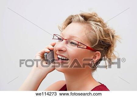 Portrait of smiling woman on the phone View Large Photo Image Stock Image - Portrait of smiling woman on the phone. Fotosearch
