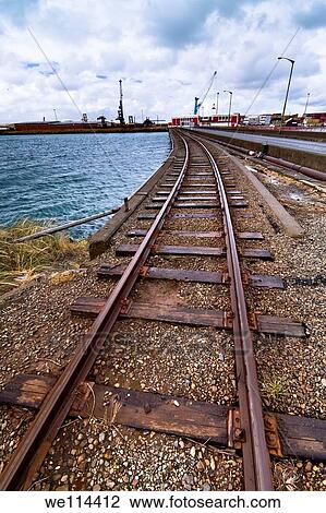 Railway track on a coast with moody sky. Bluff, South Island, New Zealand. View Large Photo Image Stock Image - Railway track on a coast with moody sky. Bluff, South Island, New Zealand.. Fotosearch