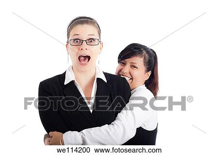 Two excited business women having fun, isolated on white background View Large Photo Image Stock Image - Two excited business women having fun, isolated on white background. Fotosearch