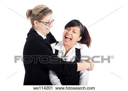 Two young happy business women funny moment, isolated on white background View Large Photo Image Stock Image - Two young happy business women funny moment, isolated on white background. Fotosearch