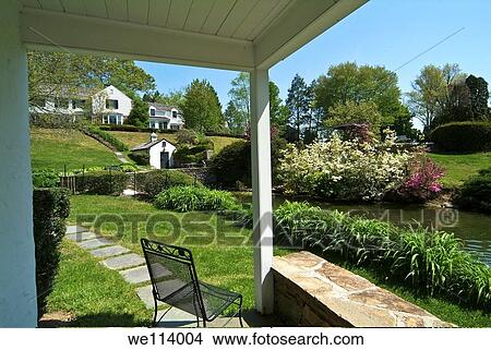 Whitewing Farm Bed and Breakfast, Chester County, Kennett Square, Pennsylvania, white wooden cottage beside pond View Large Photo Image Picture - Whitewing Farm Bed and Breakfast, Chester County, Kennett Square, Pennsylvania, white wooden cottage beside pond. Fotosearch