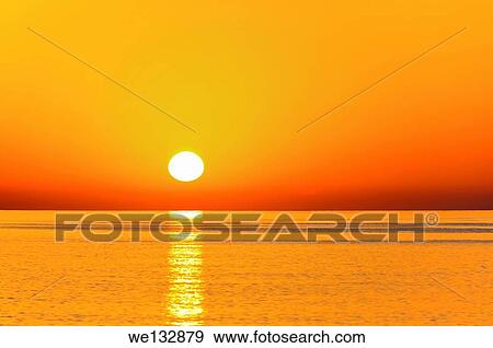 Stock Photo - Sunrise above the ocean at the beach of Tiwi, Sultanate of Oman.. Fotosearch