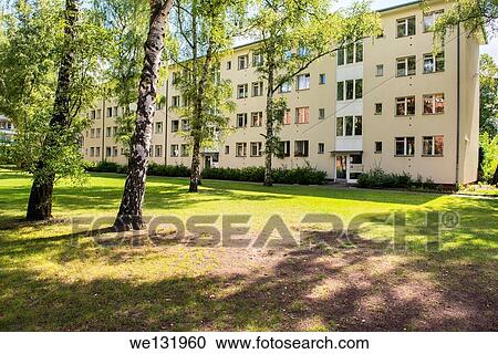 Stock Image - Berlin, Germany. UNESCO site: Schiller Park Sietlung with houses and apartment buildings in a residential area.. Fotosearch