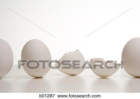 A row of eggs with one broken egg View Large Photo Image Stock Photo - A row of eggs with one broken egg. Fotosearch
