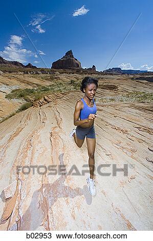 A woman running in the desert View Large Photo Image Stock Image - A woman running in the desert. Fotosearch