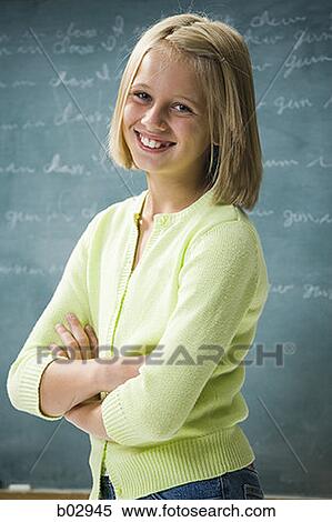 A young girl happy at school View Large Photo Image Stock Photography - A young girl happy at school. Fotosearch