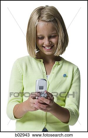 A young girl sending a text message View Large Photo Image Stock Image - A young girl sending a text message. Fotosearch