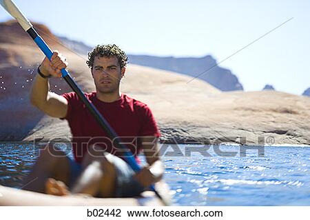 A young man kayaking View Large Photo Image Stock Image - A young man kayaking. Fotosearch