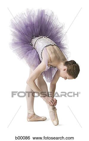 Ballerina tying her slipper View Large Photo Image Stock Photograph - Ballerina tying her slipper. Fotosearch