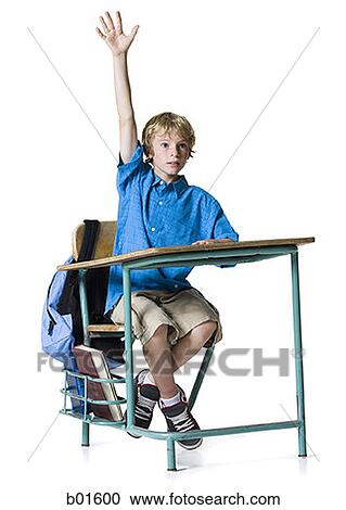 Boy raising his hand in class View Large Photo Image Stock Image - Boy raising his hand in class. Fotosearch