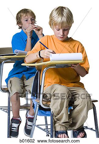 Boy shooting a spitball at another boy View Large Photo Image Stock Image - Boy shooting a spitball at another boy. Fotosearch