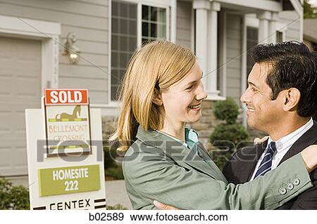 Businessman and a businesswoman looking at each other View Large Photo Image Stock Photo - Businessman and a businesswoman looking at each other. Fotosearch