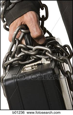 Stock Photograph - Businessman chained to a briefcase. Fotosearch