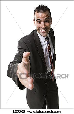Businessman extending his hand for handshake View Large Photo Image Stock Photo - Businessman extending his hand for handshake. Fotosearch