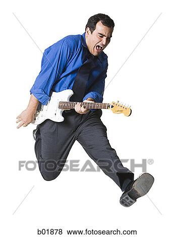 Businessman playing a guitar View Large Photo Image Stock Photo - Businessman playing a guitar. Fotosearch