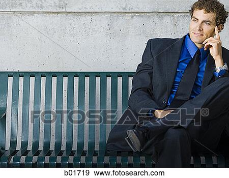 Stock Photo - Businessman sitting on a bench. Fotosearch