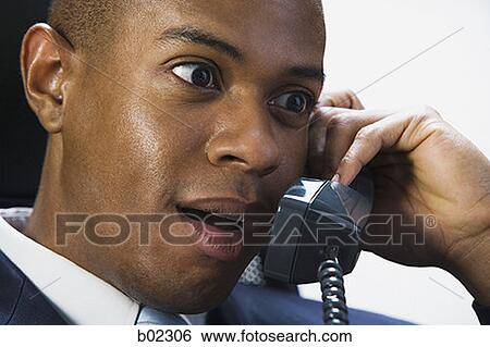 Stock Photograph - Businessman talking on the telephone. Fotosearch