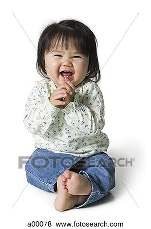 Close-up of a baby Asian girl laughing View Large Photo Image Stock Photo - Close-up of a baby Asian girl laughing. Fotosearch