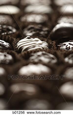 Close-up of a box of chocolates View Large Photo Image Stock Photograph - Close-up of a box of chocolates. Fotosearch