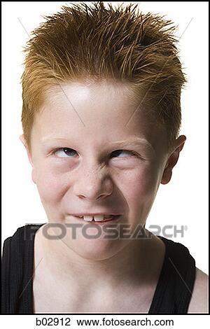 Close-up of a boy crossing his eyes View Large Photo Image Stock Image - Close-up of a boy crossing his eyes. Fotosearch