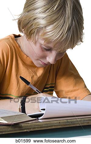 Close-up of a boy doing homework View Large Photo Image Stock Photo - Close-up of a boy doing homework. Fotosearch