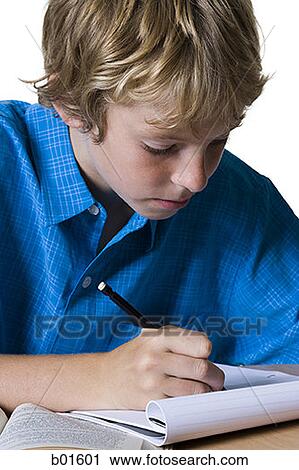 Close-up of a boy writing on a note pad View Large Photo Image Stock Image - Close-up of a boy writing on a note pad. Fotosearch