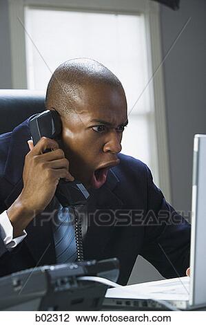 Close-up of a businessman shouting on the phone View Large Photo Image Stock Image - Close-up of a businessman shouting on the phone. Fotosearch