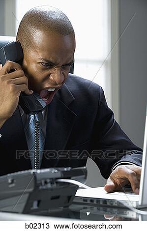 Close-up of a businessman shouting on the phone View Large Photo Image Stock Image - Close-up of a businessman shouting on the phone. Fotosearch