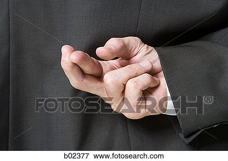 Close-up of a businessman's crossed fingers View Large Photo Image Stock Photo - Close-up of a businessman's crossed fingers. Fotosearch