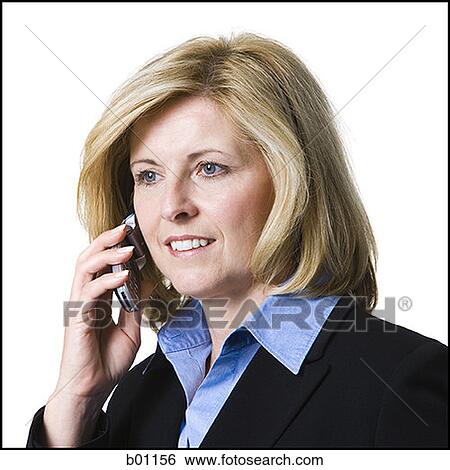 Close-up of a businesswoman talking on a mobile phone View Large Photo Image Stock Photograph - Close-up of a businesswoman talking on a mobile phone. Fotosearch