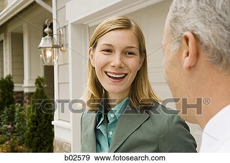 Close-up of a businesswoman talking with a businessman View Large Photo Image Stock Photo - Close-up of a businesswoman talking with a businessman. Fotosearch