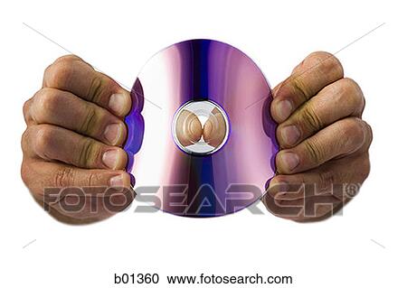 Stock Image - Close-up of a compact disk in a man's hand. Fotosearch