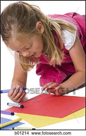 Close-up of a girl drawing on a sheet of paper View Large Photo Image Picture - Close-up of a girl drawing on a sheet of paper. Fotosearch