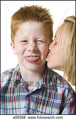 Close-up of a girl kissing a boy View Large Photo Image Stock Photo - Close-up of a girl kissing a boy. Fotosearch