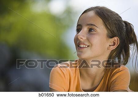 Close-up of a girl looking sideways View Large Photo Image Stock Image - Close-up of a girl looking sideways. Fotosearch