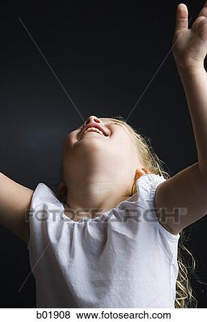 Close-up of a girl looking up View Large Photo Image Stock Photo - Close-up of a girl looking up. Fotosearch