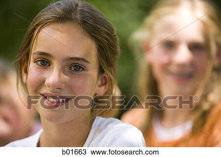 Close-up of a girl smiling View Large Photo Image Stock Image - Close-up of a girl smiling. Fotosearch