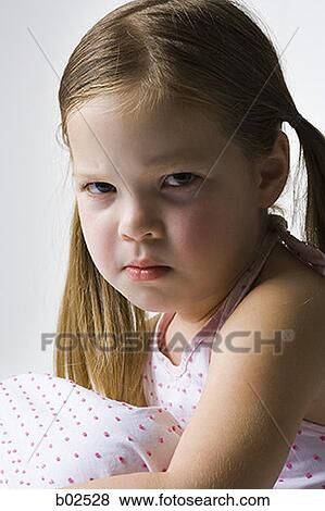 Close-up of a girl sulking View Large Photo Image Stock Photo - Close-up of a girl sulking. Fotosearch
