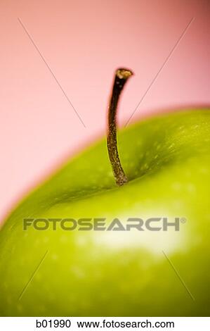 Stock Image - Close-up of a granny smith apple. Fotosearch
