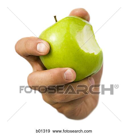 Close-up of a hand holding a bitten apple View Large Photo Image Stock Photo - Close-up of a hand holding a bitten apple. Fotosearch