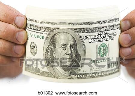 Close-up of a hands holding one hundred dollar bills View Large Photo Image Stock Image - Close-up of a hands holding one hundred dollar bills. Fotosearch