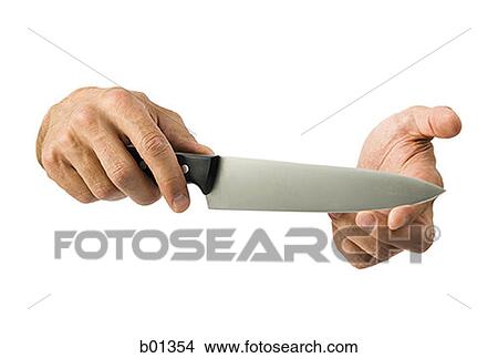 Close-up of a knife in a man's hand View Large Photo Image Picture - Close-up of a knife in a man's hand. Fotosearch