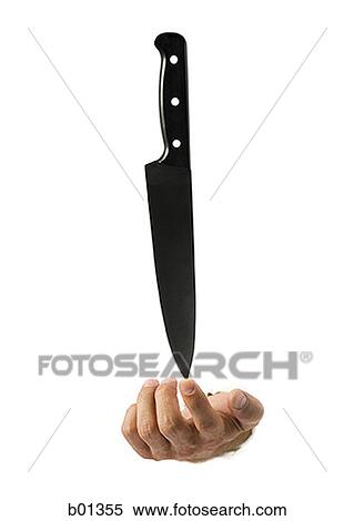 Stock Photography - Close-up of a knife in a man's hand. Fotosearch