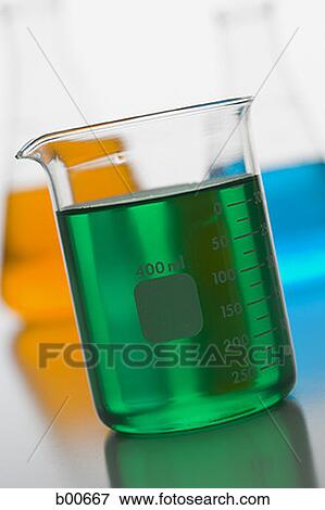 Close-up of a measuring beaker with green liquid View Large Photo Image Stock Photo - Close-up of a measuring beaker with green liquid. Fotosearch