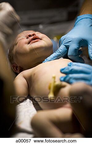 Stock Photo - Close-up of a newborn baby girl. Fotosearch