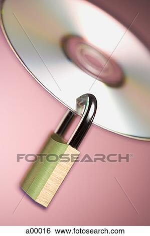 Close-up of a padlock hanging from a compact disc View Large Photo Image Stock Photograph - Close-up of a padlock hanging from a compact disc. Fotosearch