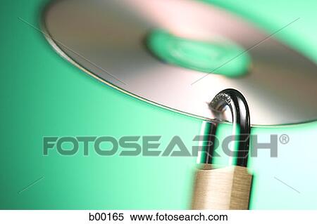 Close-up of a padlock hanging from a compact disk View Large Photo Image Stock Photography - Close-up of a padlock hanging from a compact disk. Fotosearch